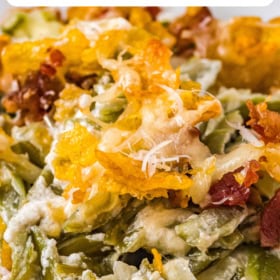 Creamed green beans on a plate with crispy topping.